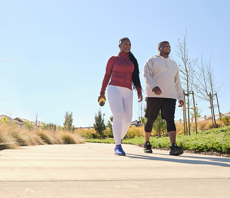 A couple walking on a nature trail