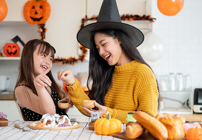 Mother and daughter make Halloween treats