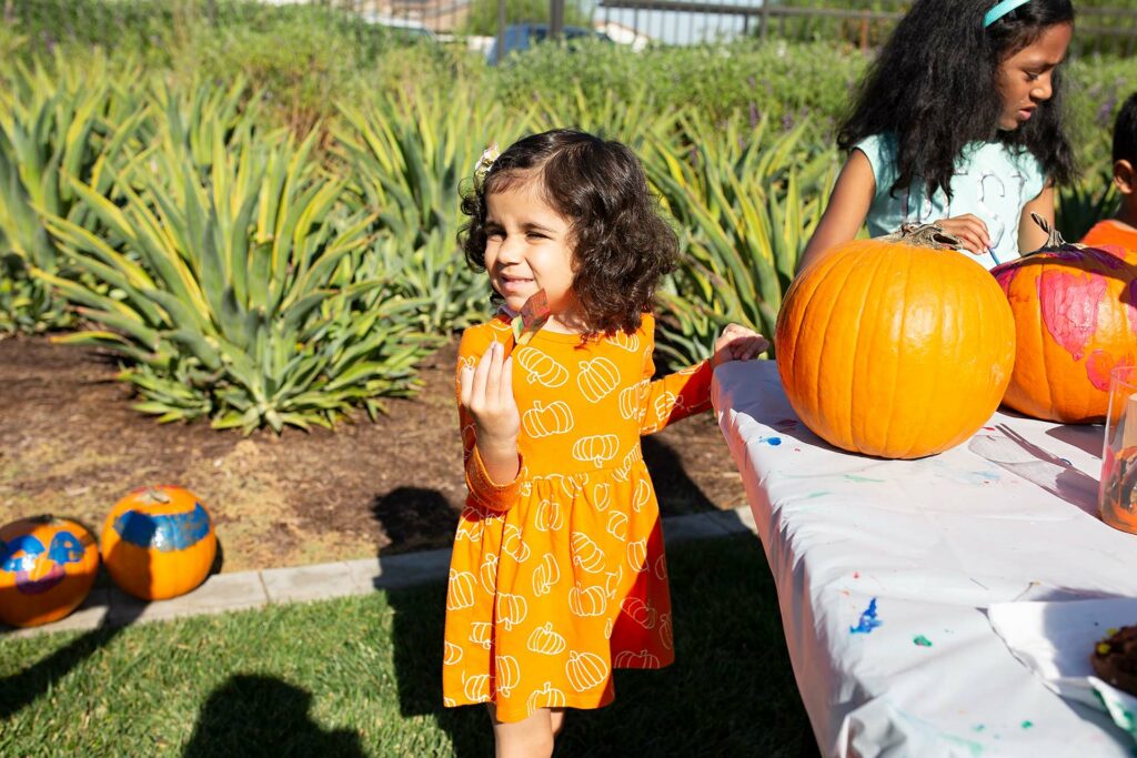 Young girl with pumpkin at the Tracy Hills Fall Celebration